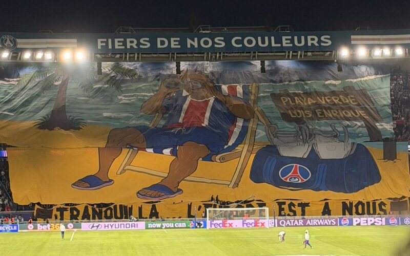 Collectif Ultras Paris display a giant Luis Enrique beach-themed tifo before PSG vs Slovan Bratislava